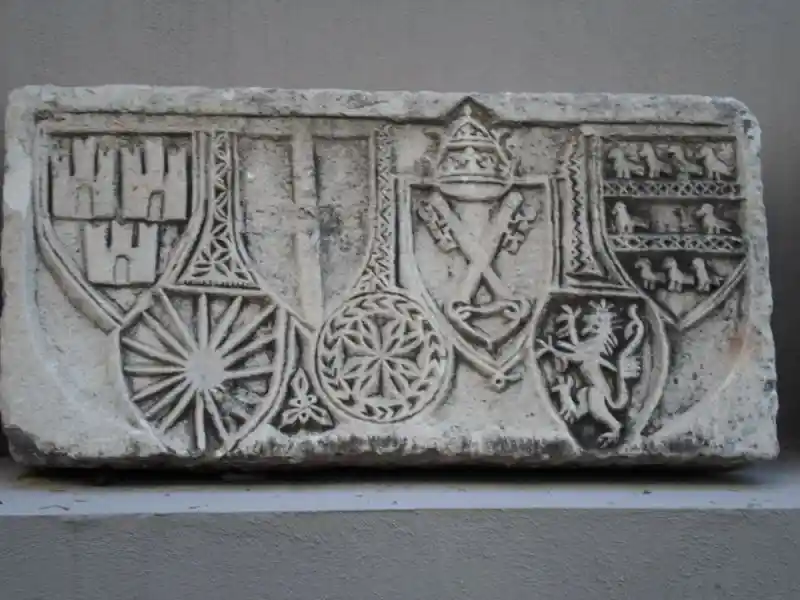 Shields with different designs engraved on a marble stone, located at the Archaeological Museum of Izmir, Turkey